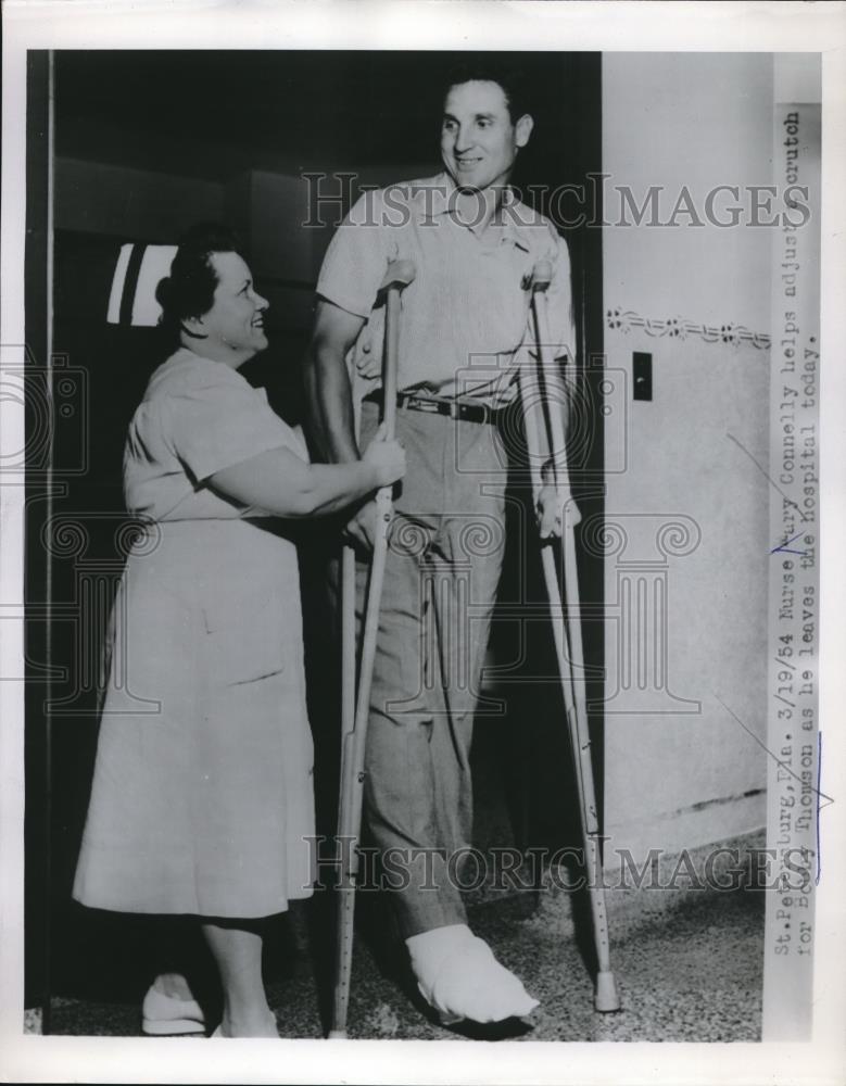 1954 Press Photo Nurse Mary Connely Helps Bobby Thomson Leaving Hospital - Historic Images