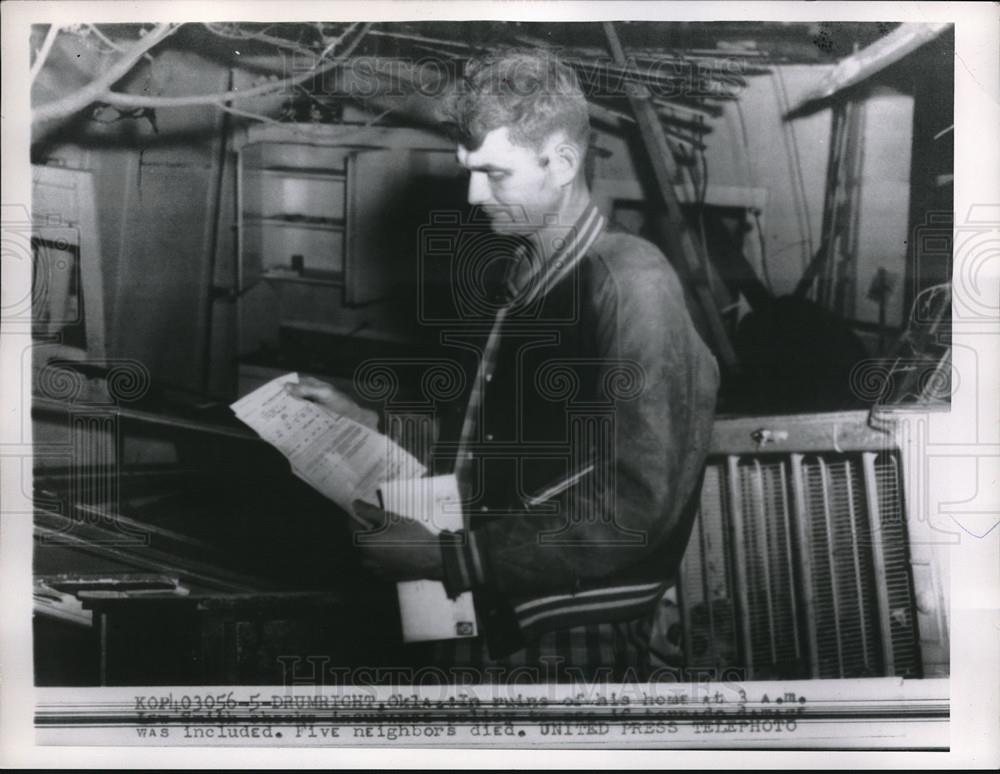 1956 Press Photo Joe Smith looking over his Insurance policy after tornado - Historic Images