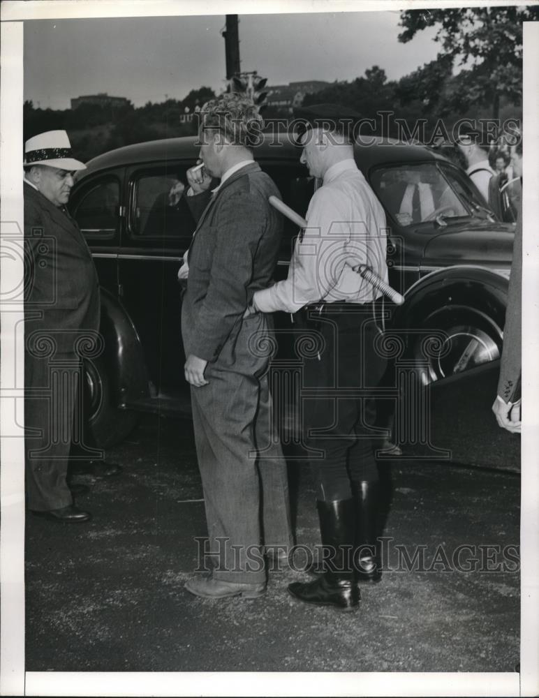 1941 Press Photo Employee of Air Associates Inc Plant Searched by Police - Historic Images