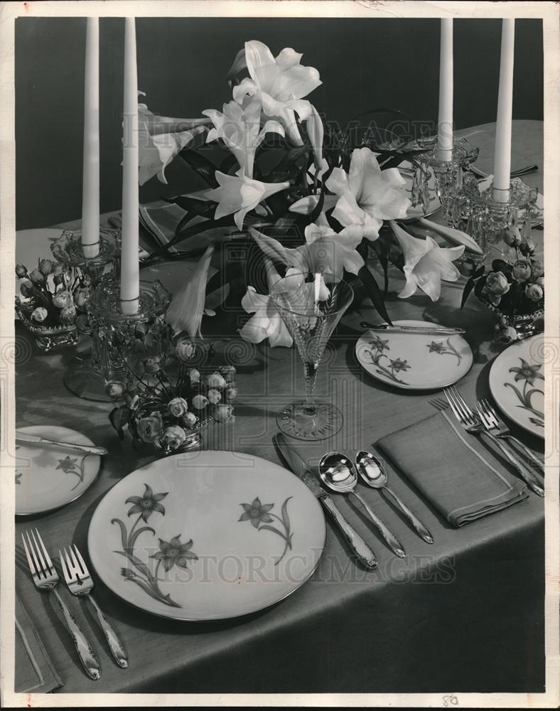 Press Photo A table set up for Easter dinner with candles and Lenox china. - Historic Images