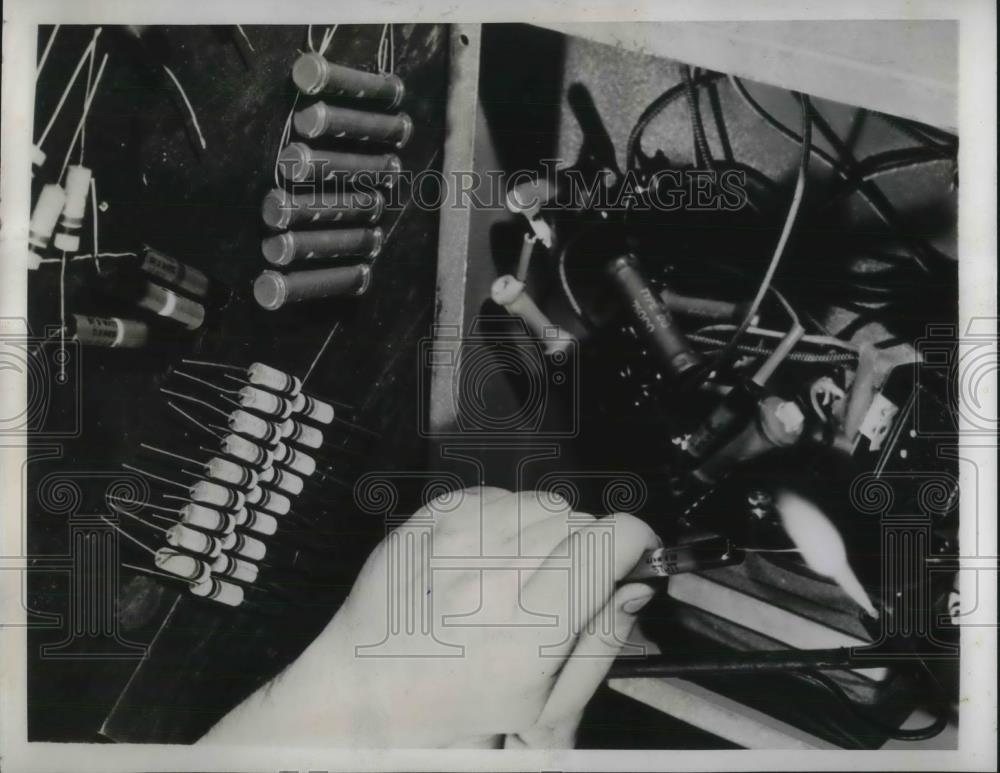 1941 Press Photo Worker Installs Resistor into Ammeter in Westinghouse Factory - Historic Images
