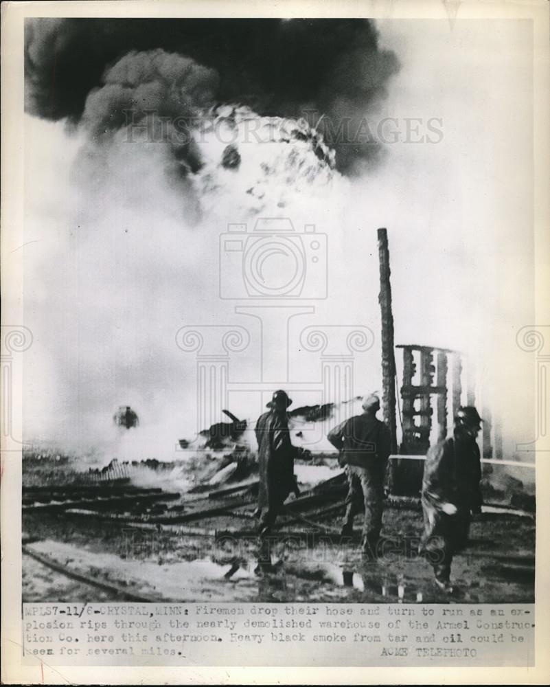 1951 Press Photo Crystal, Minn. firemen at Armen Construction Co blaze - Historic Images