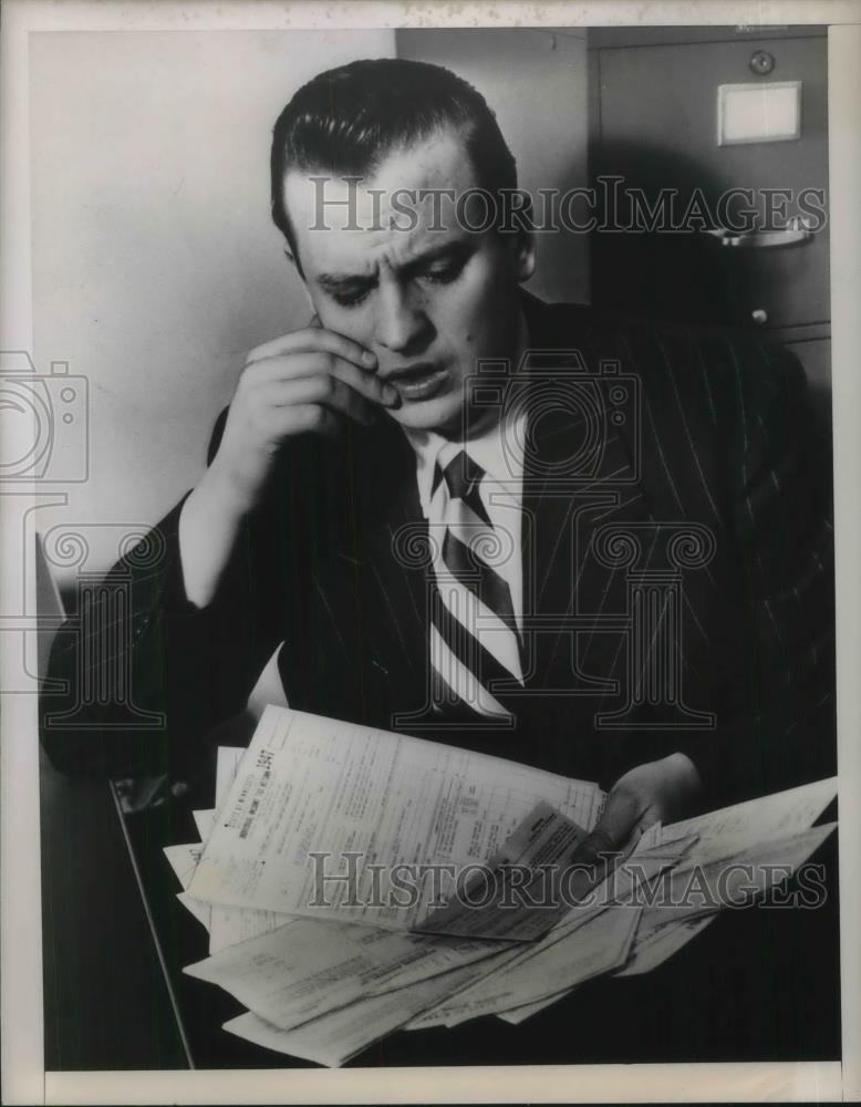 1948 Press Photo Carlo Anneke of Duluth Minn w/ tons of paper works - neb95787 - Historic Images