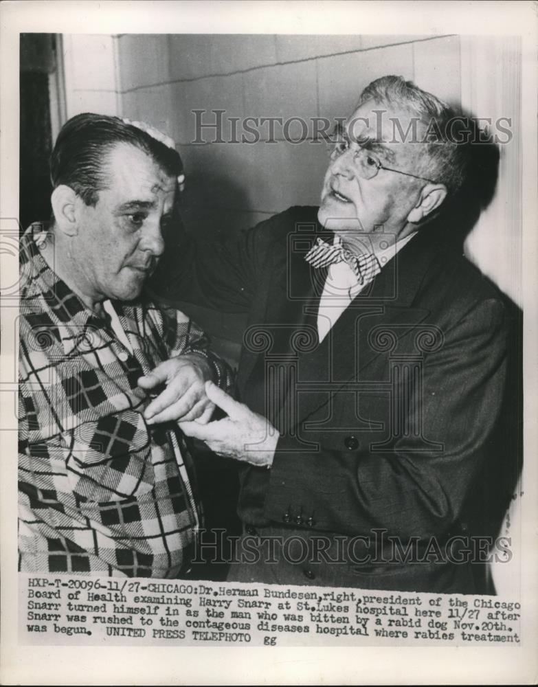 1953 Press Photo Dr. Herman Bundesen Examines Harry Snarr Bitten by Rabid Dog - Historic Images