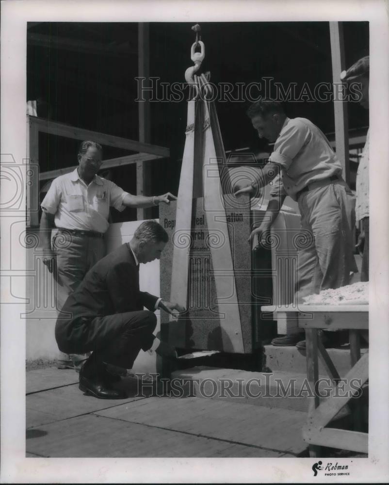 1957 Press Photo Charles White Sets Position of Cornerstone for Republic Steel - Historic Images