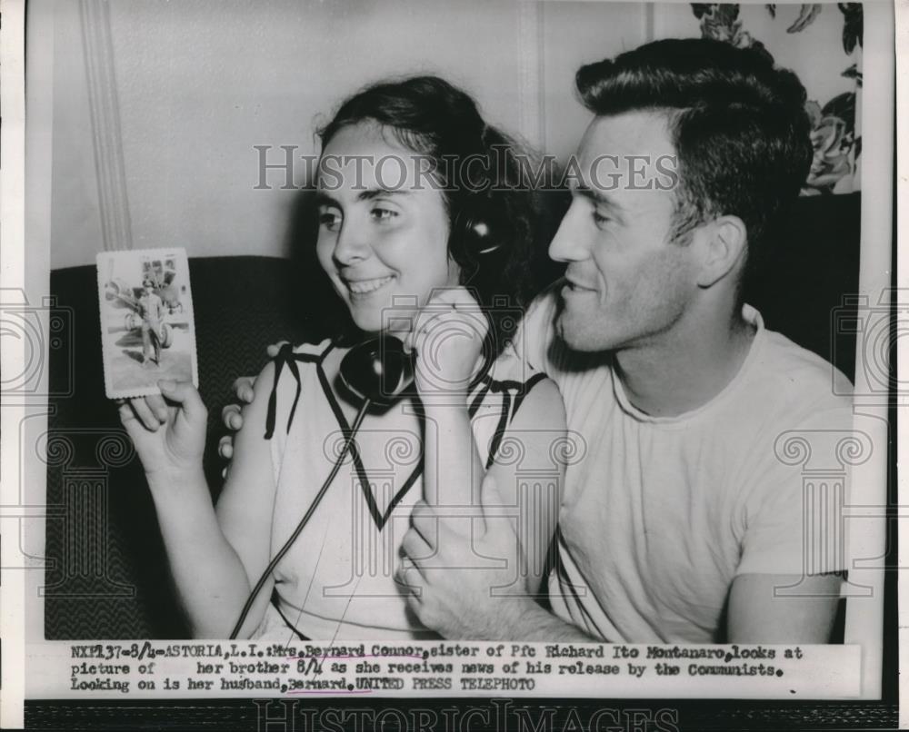 1953 Press Photo Mrs Bernard Connor Looks At Picture Of Brother - nec10095 - Historic Images