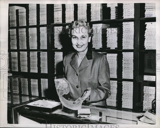 1956 Press Photo handsome sales woman showing product w/ pride - Historic Images