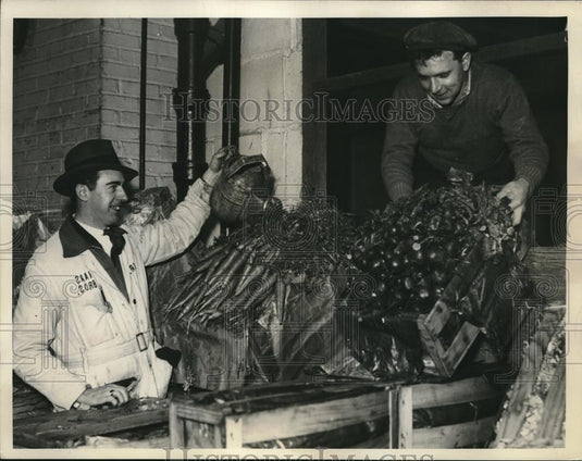 1935 Press Photo men watering vegetables at Cleveland Terminal - Historic Images