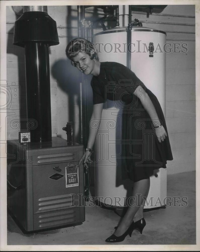 1963 Press Photo Woman Poses with Boiler System - neb98035 - Historic Images