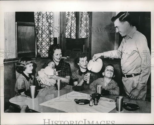 1953 Press Photo George Smith & family enjoys a glass of milk - nec11743 - Historic Images