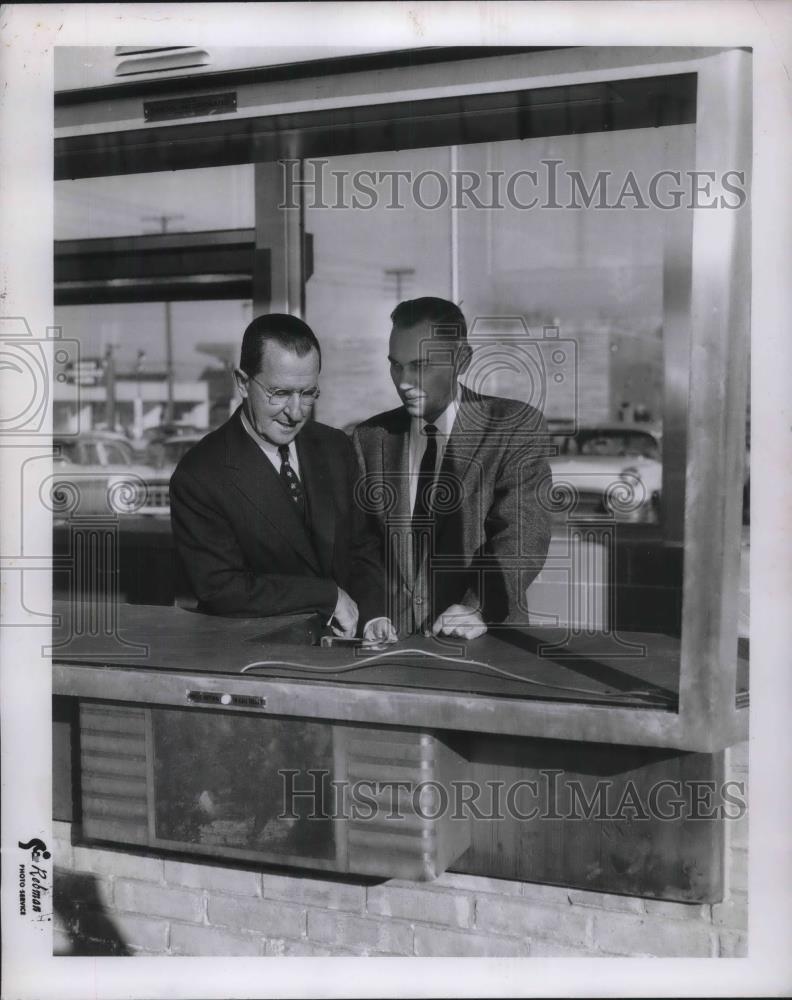 1957 Press Photo 2 Men Talking at Drive Through Window - Historic Images