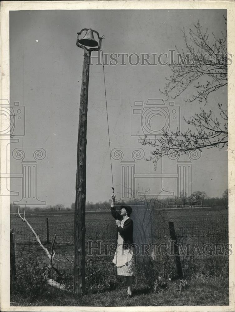 1941 Press Photo Mrs. Nelson ringing a bell - nec19373 - Historic Images