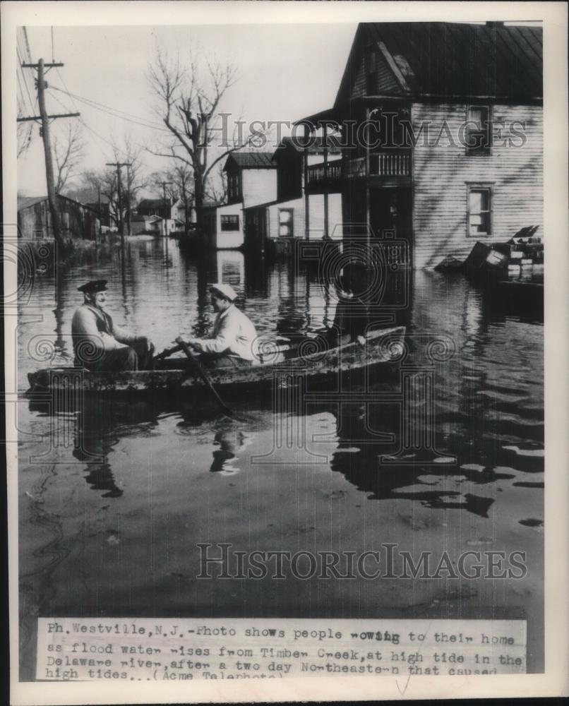 1948 Press Photo People Ride In Boat To Their Home After Flooding - nec24209 - Historic Images