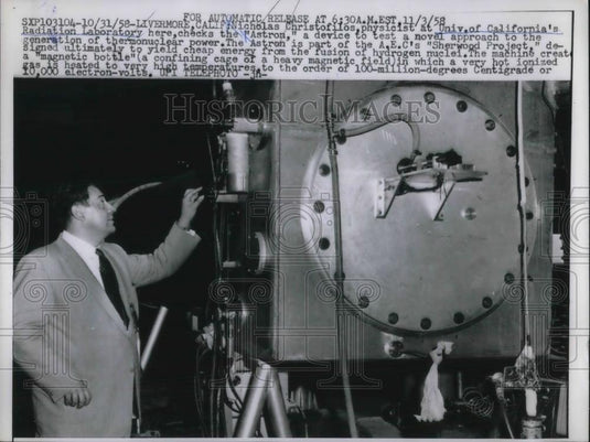 1958 Press Photo Nicholas Christofilos, physicist, Checks the "Astron". - Historic Images