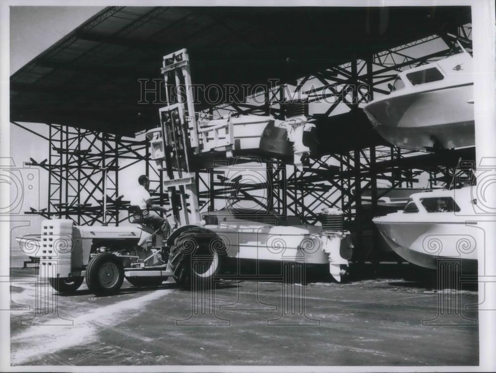 1960 Press Photo Forklift makes triple storage at City Island Marina Sarasota FL - Historic Images