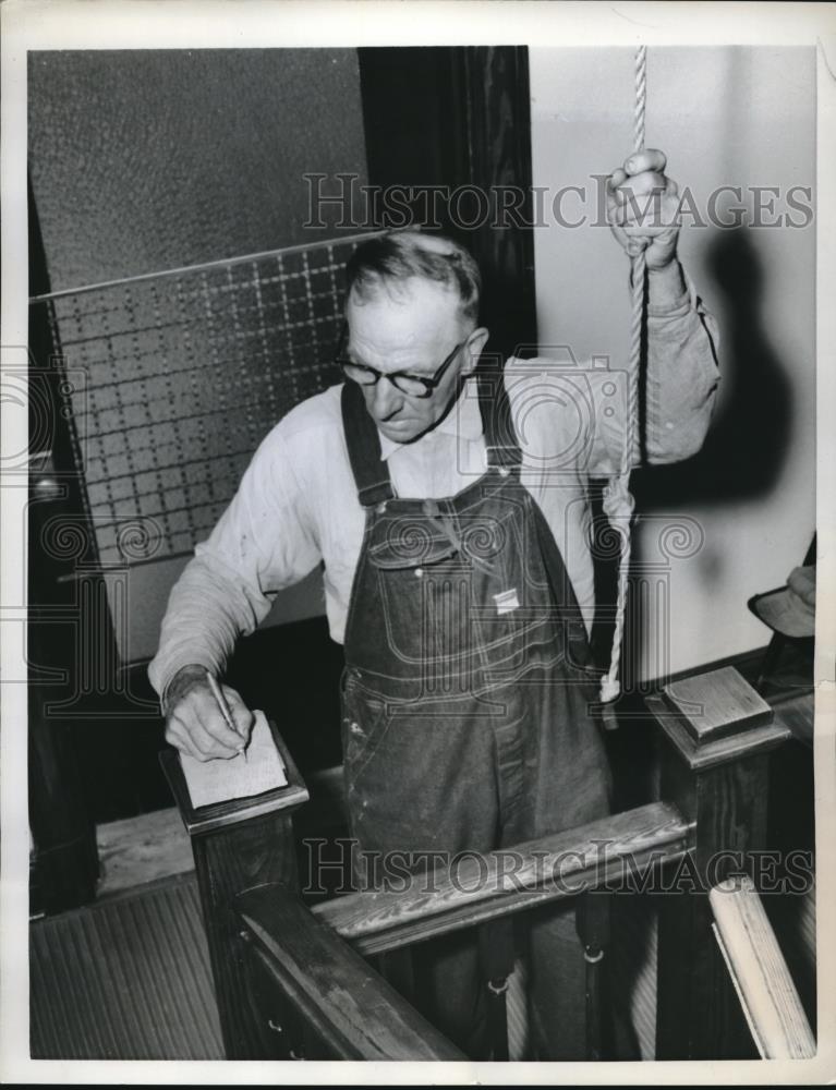 1958 Press Photo Custodian Walter Steig Keeps Track Of Bell Tolls At Funeral - Historic Images