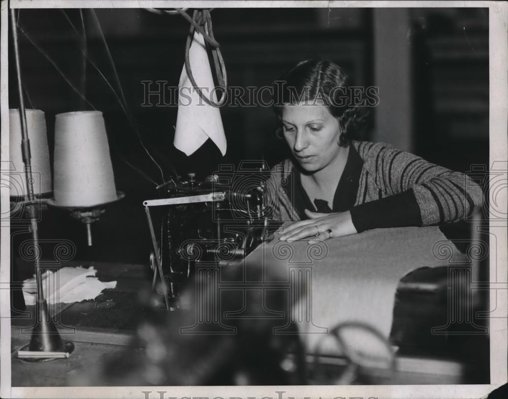 1934 Press Photo &quot;Serging&quot; Edge of Fabric Carmella Maleonico - nec30913 - Historic Images