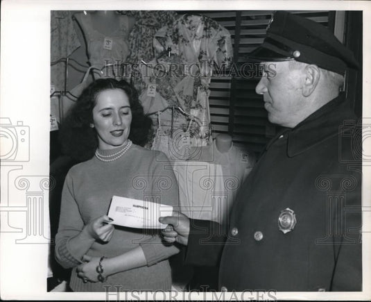 1949 Press Photo Hazleton policeman serves mock subpoena to salesgirl - Historic Images