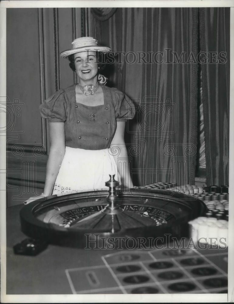 1934 Press Photo Mrs Ira I Warner, presiding at the roulette wheel - nec47799 - Historic Images