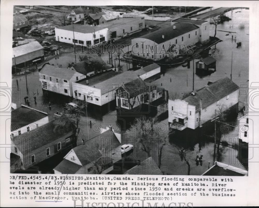 1956 Press Photo Flooded section of the Business section of MacGregor Canada. - Historic Images