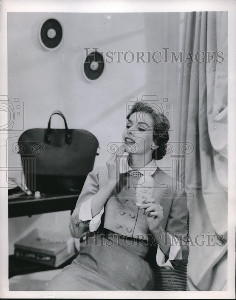 1953 Press Photo Female Model Shows How To Put Lotion On Face Beauty Products - Historic Images