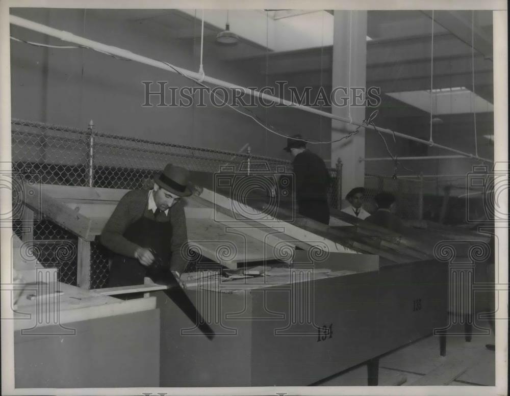 1938 Press Photo Workmen readying merchandise for First Avenue retail market. - Historic Images