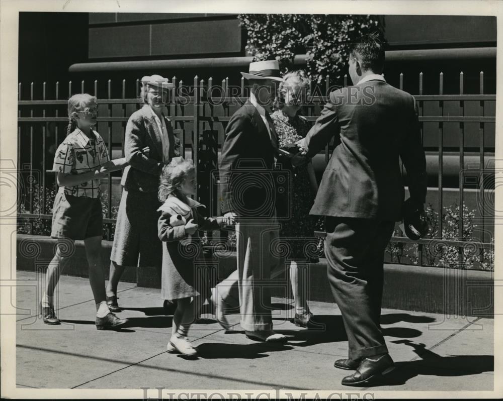 Couples on way to church meet with a photographer1940 Press Photo - Historic Images