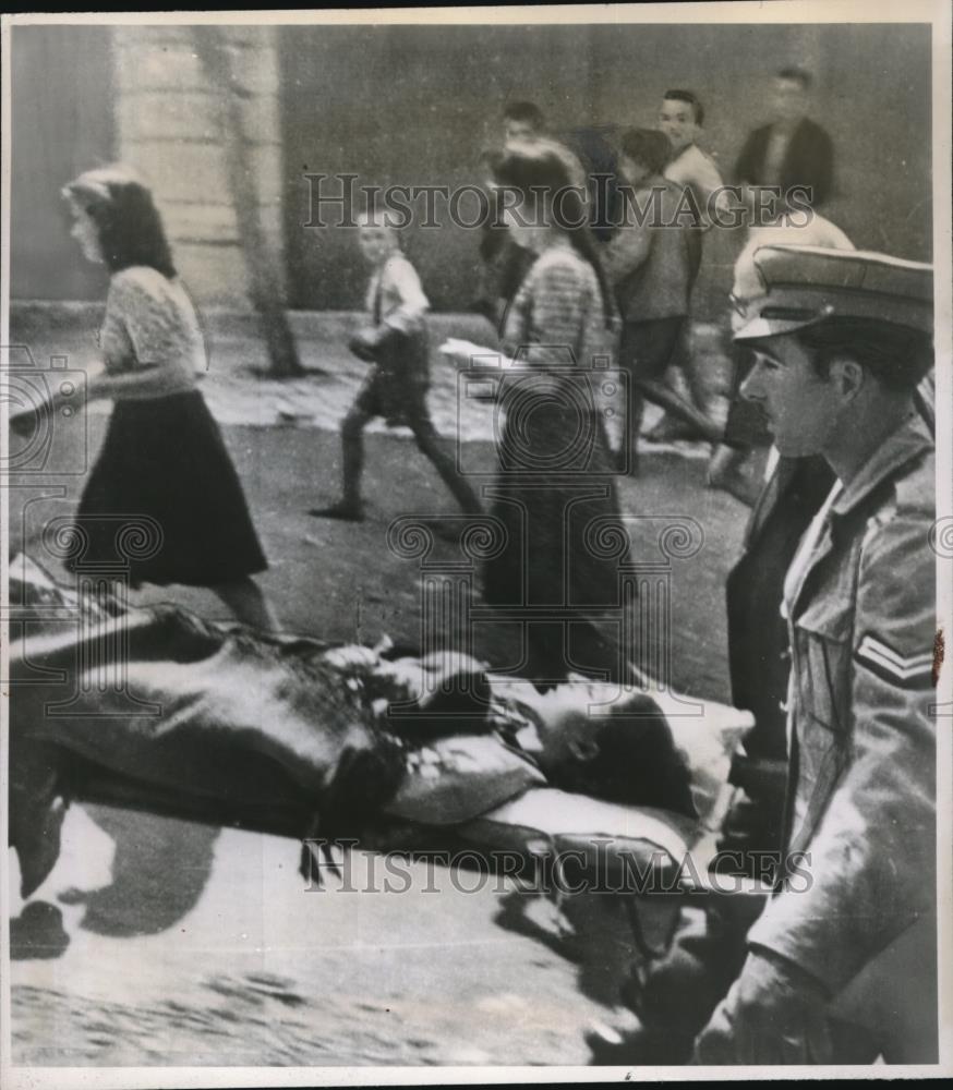 1947 Press Photo Girl Hit By Bullet Carried Through Streets of Amyndeon - Historic Images