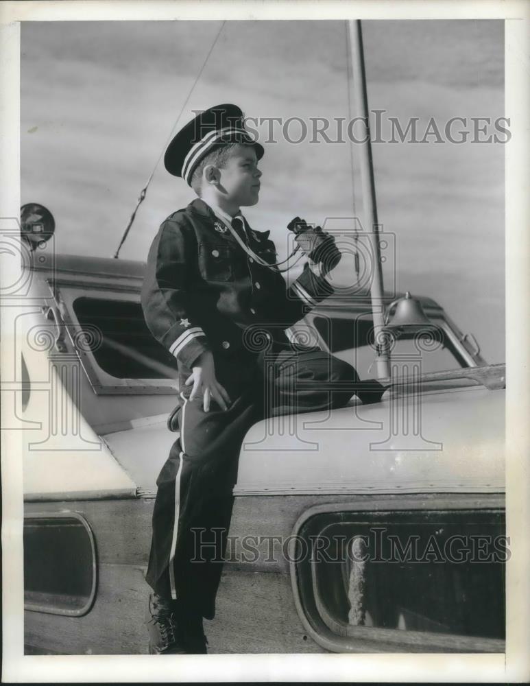 1942 Press Photo Boy in Navy Uniform Sitting on a Boat - Historic Images