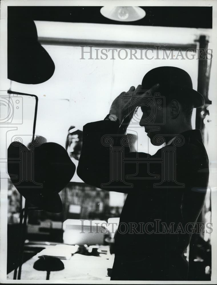 1962 Press Photo Man adjusting a bowler in a London Hat Shop. - Historic Images