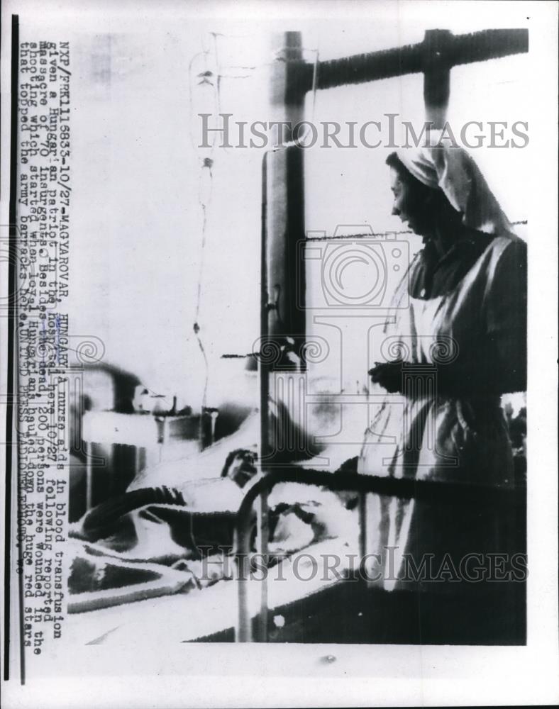 1956 Press Photo A nurse giving a blood transfusion to an Hungarian patriot - Historic Images