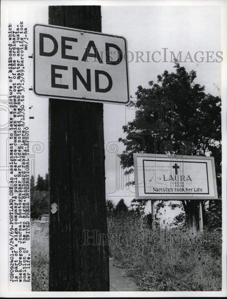 1969 Press Photo Portland Ore Billboard &amp; traffic signs in a pun setting - Historic Images