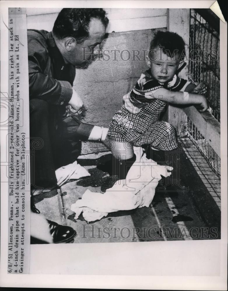 1951 Press Photo 2 yr old James Hinman gets leg stuck in drain pipe - Historic Images