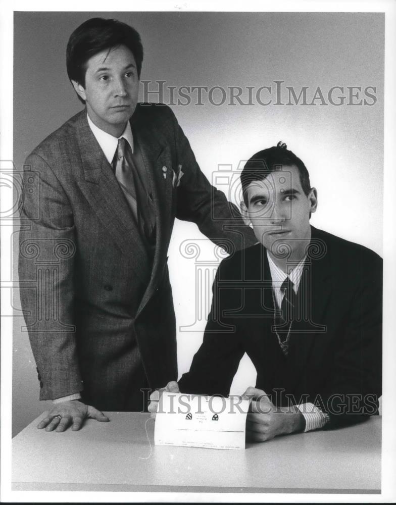 1990 Press Photo James M. Craciun seated Horia V.M. Gavrilitza, - Historic Images