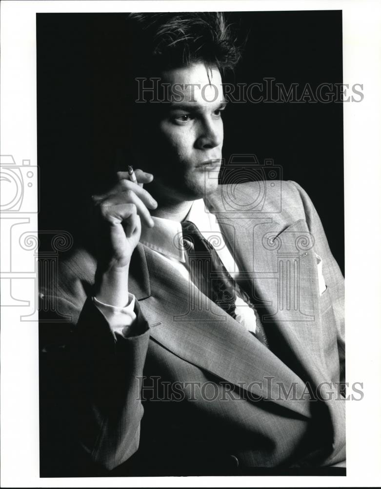 1991 Press Photo Jimmy Armstrong Smoking Cigarette - Historic Images