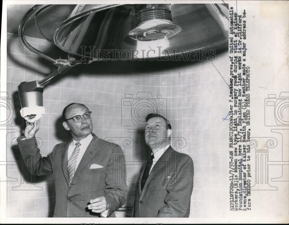 1957 Press Photo Walter P. Reuther being shown new type light in surgery room - Historic Images