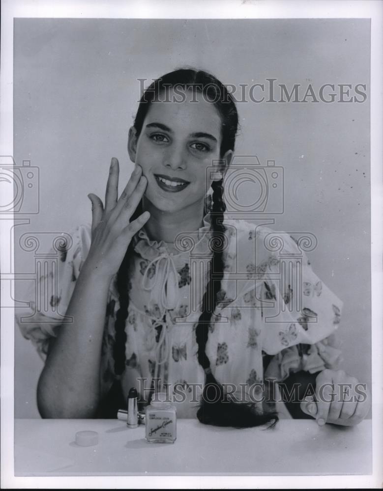 1955 Press Photo Model showing how to care for your skin - Historic Images