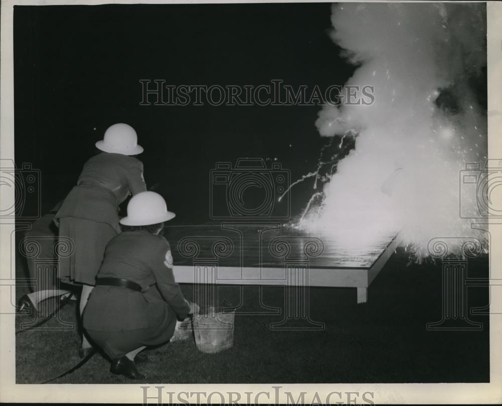 1943 Press Photo Fire fighters detonate a incendiary bomb. - Historic Images