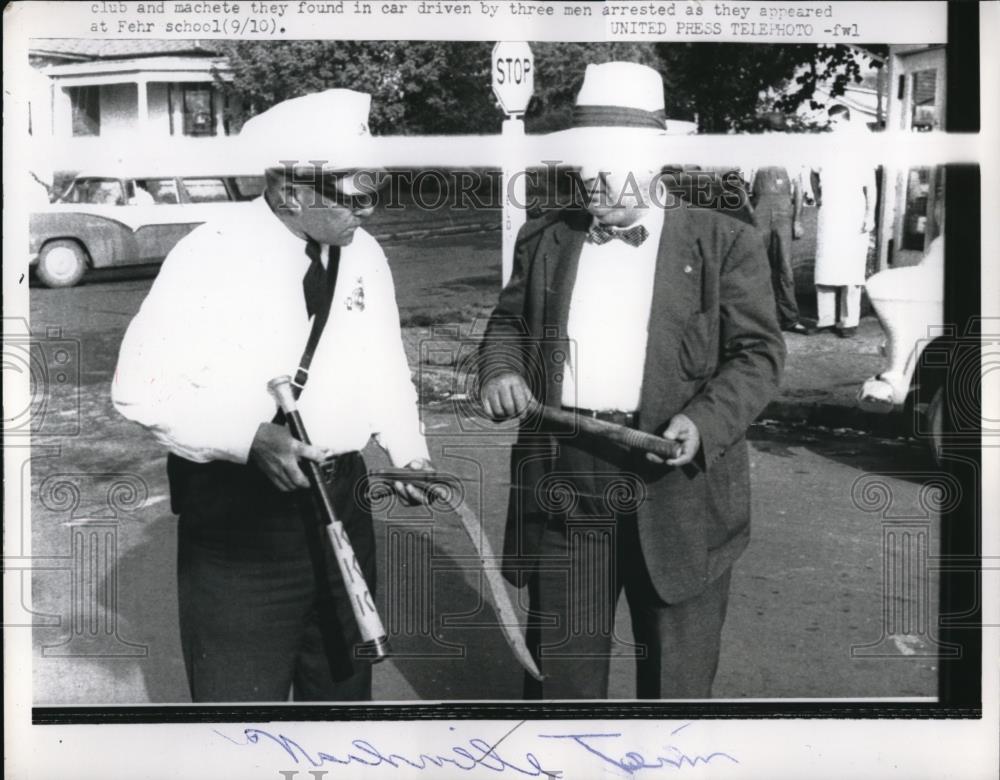 1957 Press Photo Police with machete found in arrested mens car - Historic Images