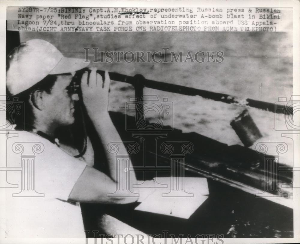 1946 Press Photo A.M. Khoklov of Russian press studying underwater nuclear blast - Historic Images