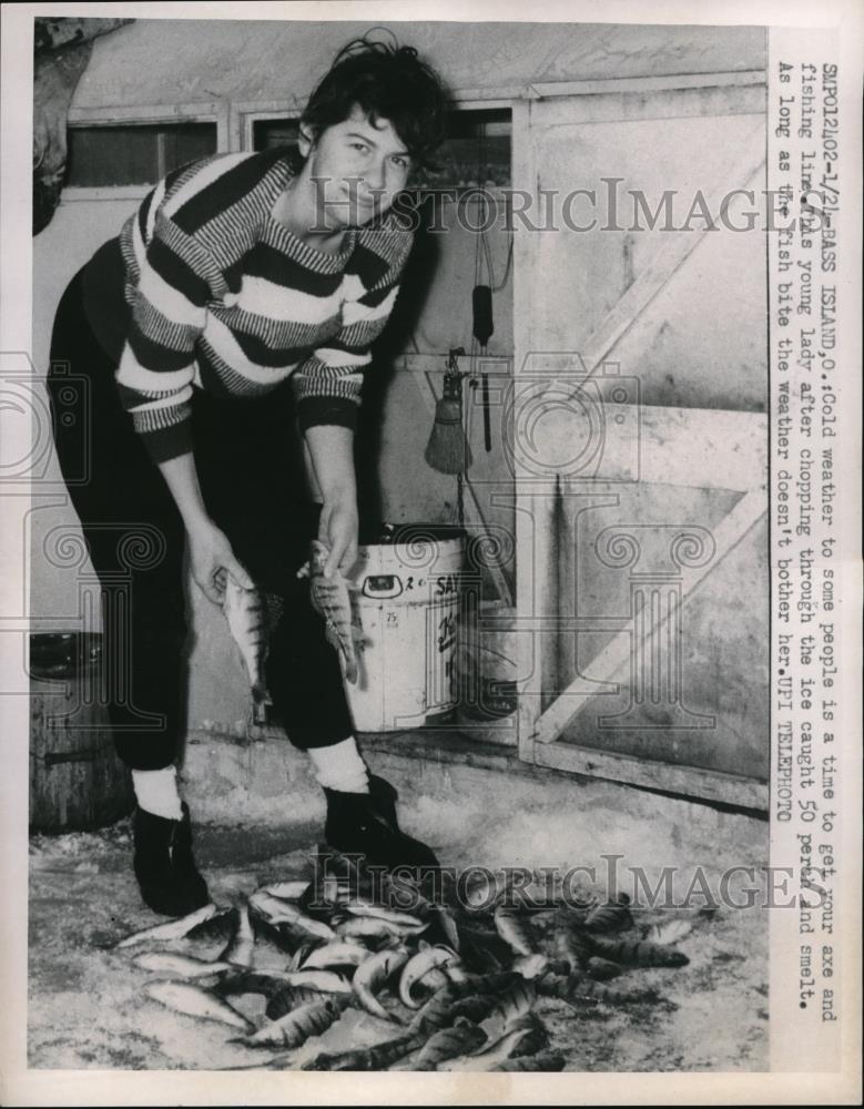 1963 Press Photo Young Lady Chops Up Ice And Goes Fishing - Historic Images