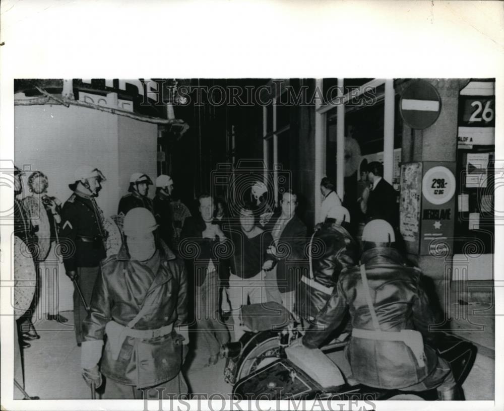 1970 Press Photo Man Accused of Throwing Firebombs at Police Led Away By Police - Historic Images