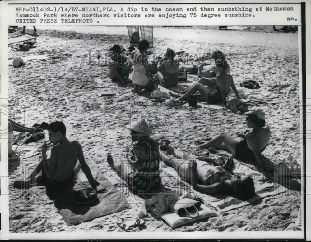 1957 Press Photo Miami Fla a dip in the ocean and then sunbathing at Matheson - Historic Images