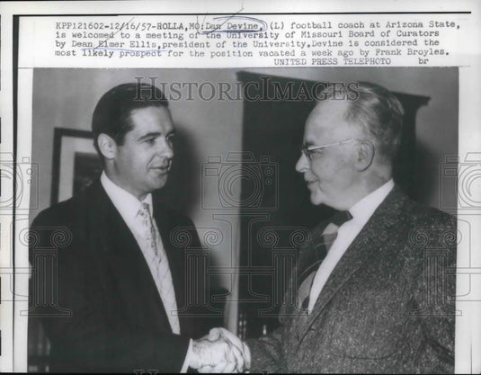 1957 Press Photo Coach Dan Devine welcomed to meeting by Dean Elmer Ellis - Historic Images