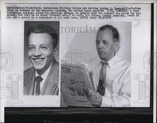 1957 Press Photo L.I. Zamorski held by police as J. Zamorski, reads about it - Historic Images