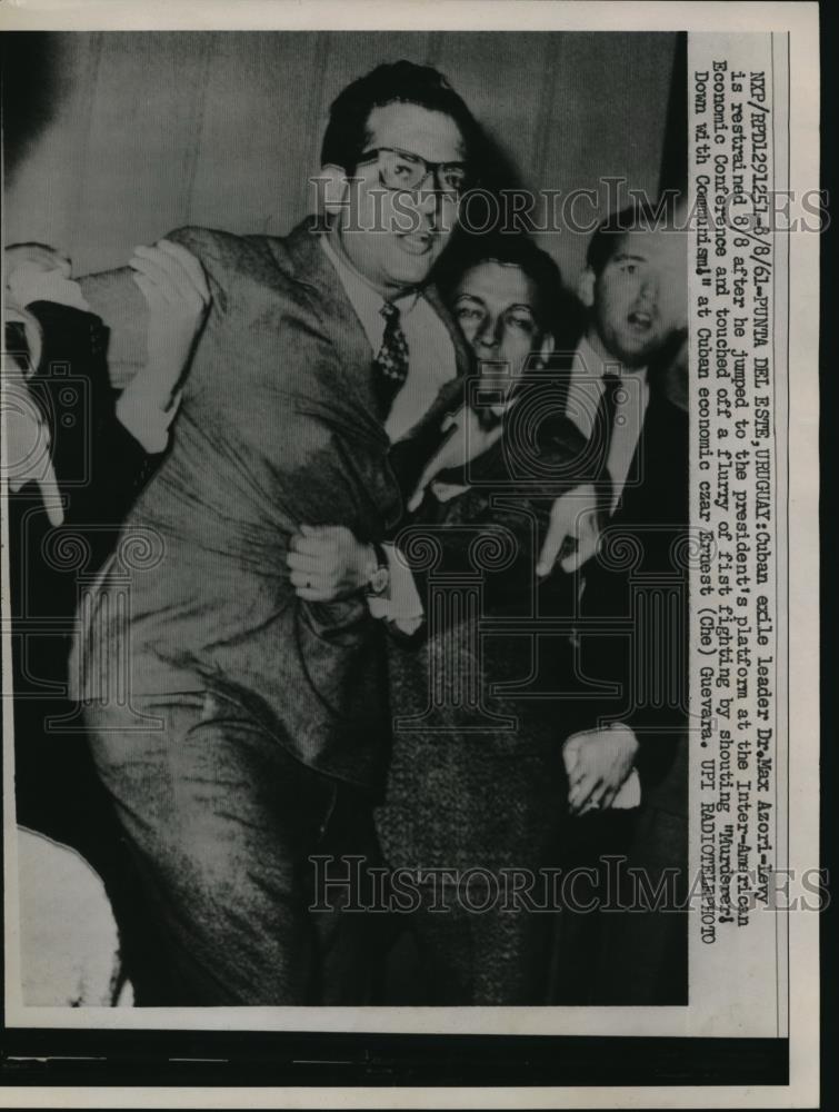 1961 Press Photo Cuban exile leader Dr. Max Azori-Levy is restrained - Historic Images