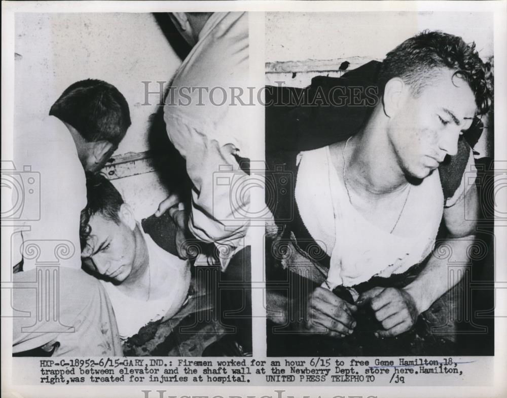 1953 Press Photo Gary Ind Firemen worked for an hour to free Gene Hamilton, - Historic Images