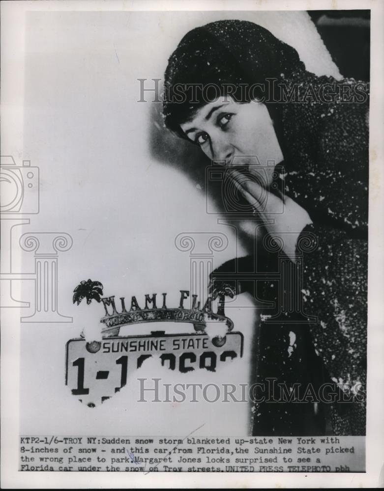 1954 Press Photo Margaret Jones looks surprised to see a car under a snow - Historic Images