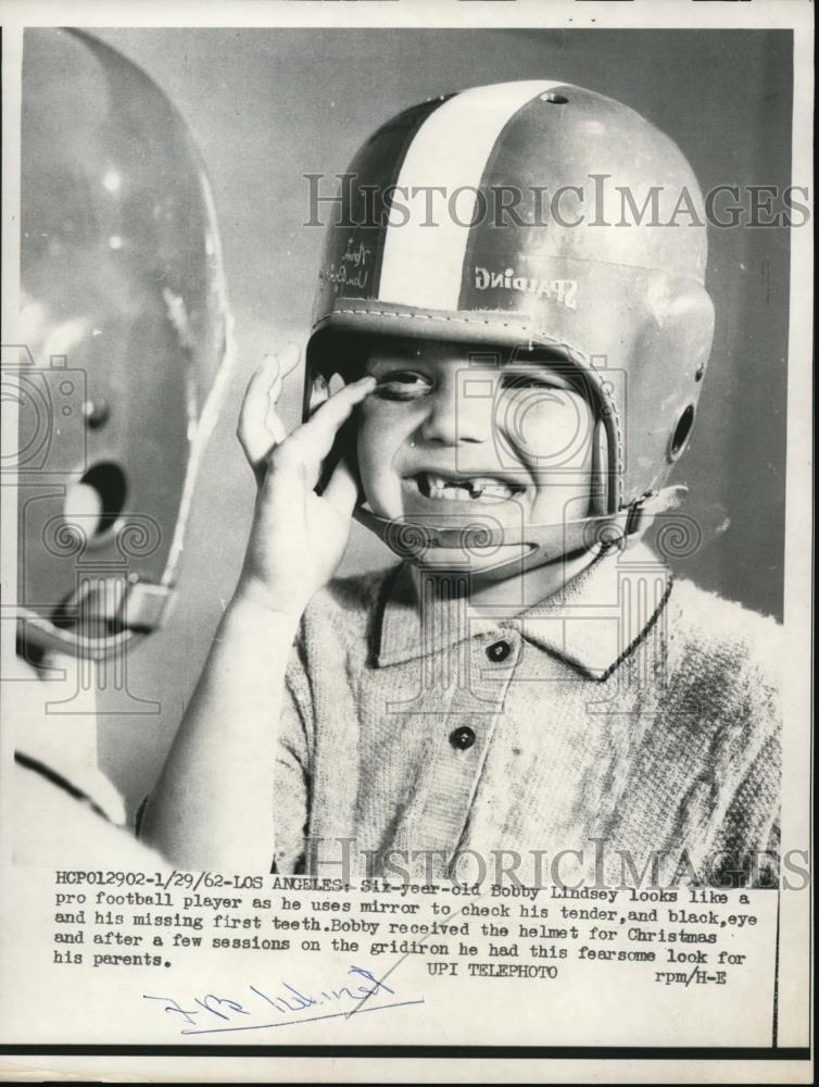 1962 Press Photo Six-year-old Bobby Lindsey looks like a pro football player. - Historic Images