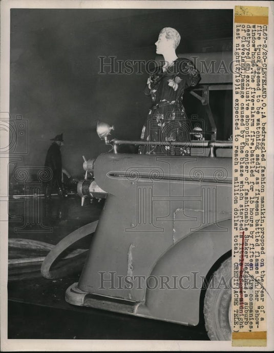 1949 Press Photo Cleveland Ohio a fashion manikin propped on rear of fire truck - Historic Images